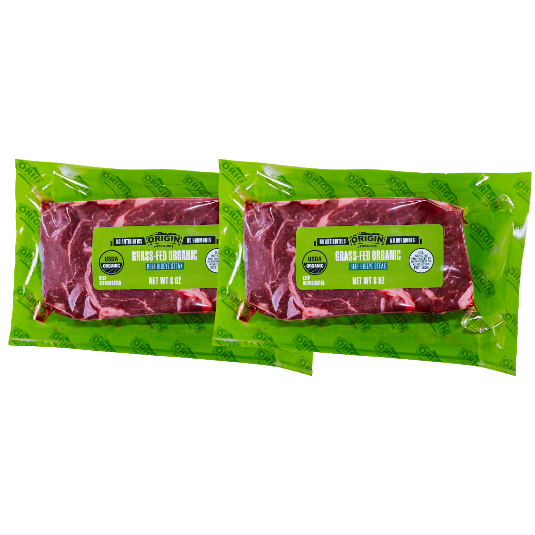 Two packages of Origin organic grass-fed ribeye steaks