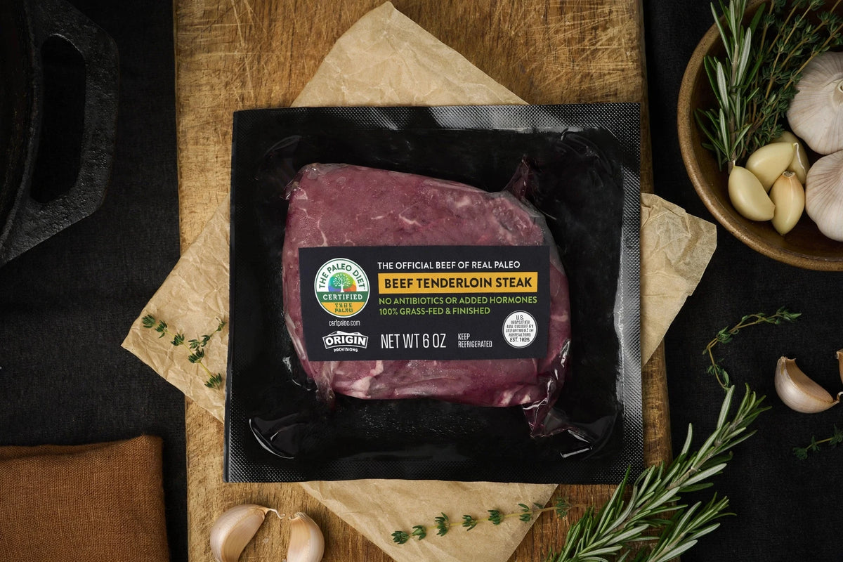 The Paleo Diet grass-fed beef tenderloin steak, 6 oz., in packaging with herbs and garlic
